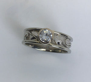 sparkling  bezel set round diamond ring with leaves in 14K white gold