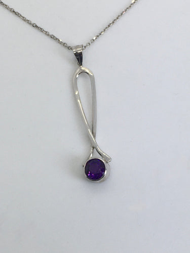 faceted bezel set round amethyst in white gold loop pendant