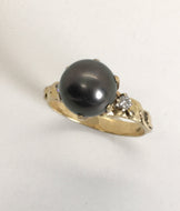 lustrous black pearl with leaves & diamonds