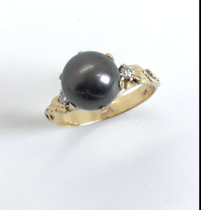 black pearl 14 kg ring with leaves on the sides