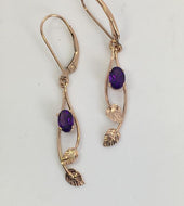 romantic deep purple Amethysts rest between rose gold leaves and vines