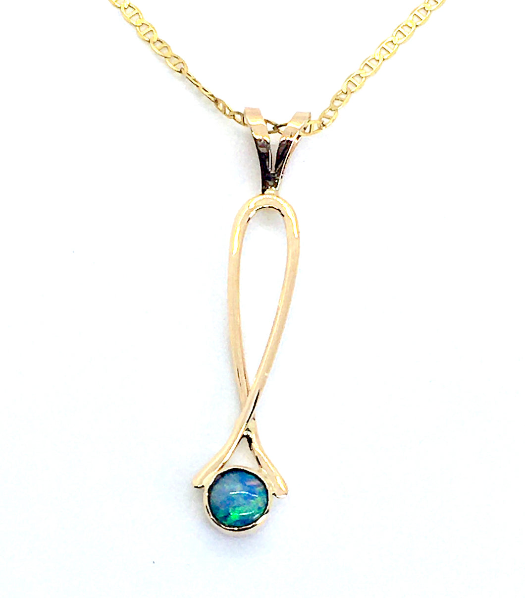 round bezel set opal with bright blue/green flash in a 14Kg exclamation point pendant